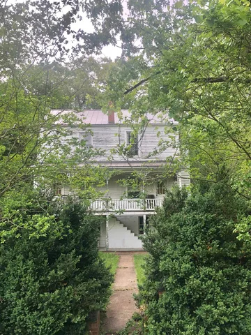 a view of a balcony with furniture
