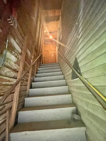 a bathroom with a double vanity sink mirror and shower