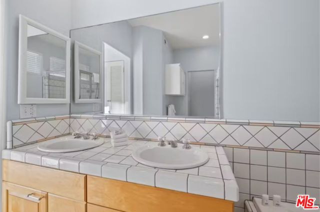 a view of balcony with two chairs and a table