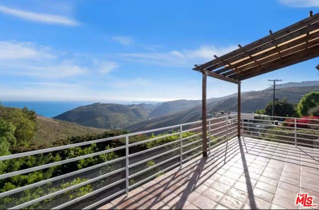 a view of a chairs and table on the wooden floor