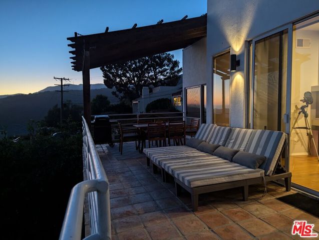 a view of a terrace with sitting area