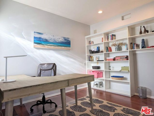 a view of a dining room with furniture and a window