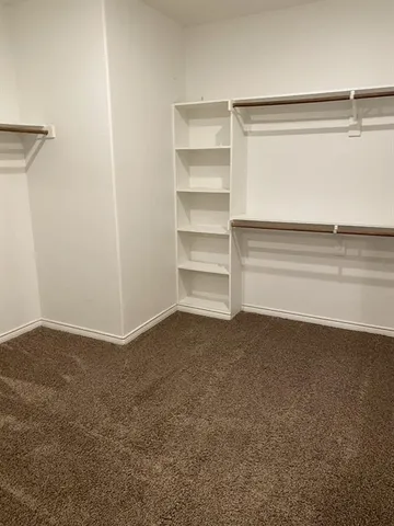a view of an empty walk in closet