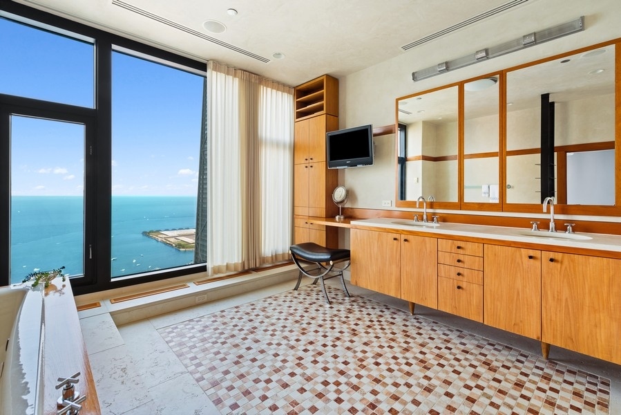 132 East Delaware Place, Unit 6502 Chicago, IL 60611 - Photo 16 of 27 a room with a sink and a window