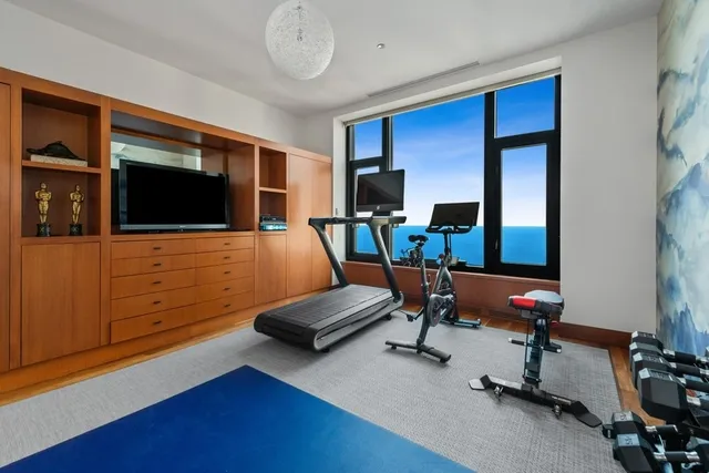 a view of a livingroom with furniture and a flat screen tv