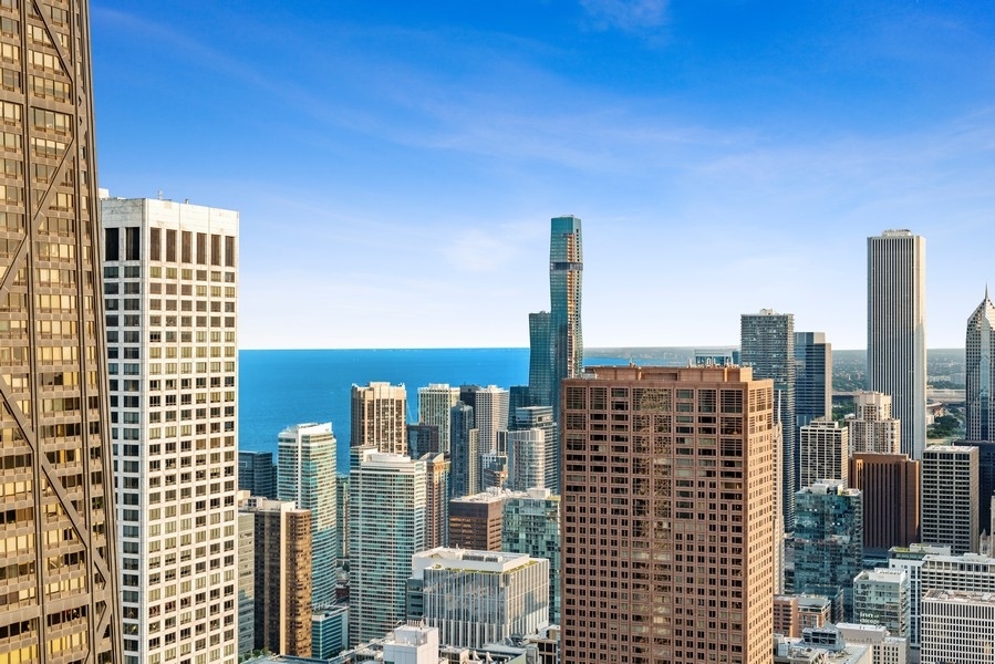 132 East Delaware Place, Unit 6502 Chicago, IL 60611 - Photo 26 of 27 a city view with tall buildings