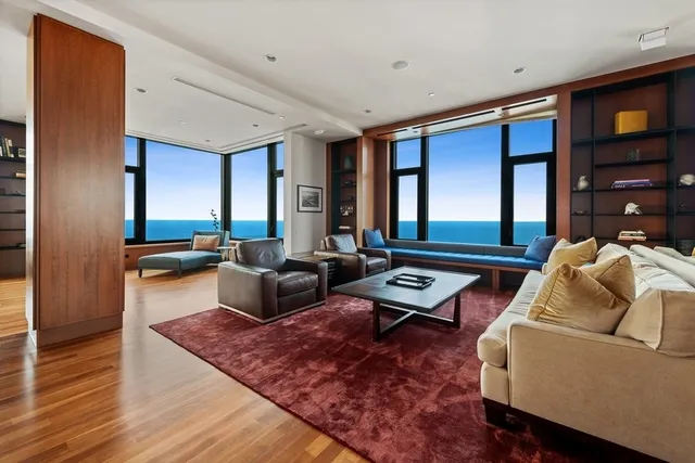 a living room with furniture and a rug