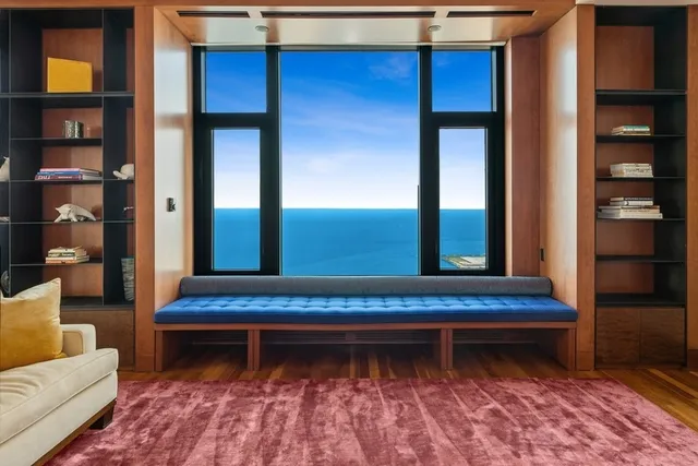 a living room with a rug and a rug