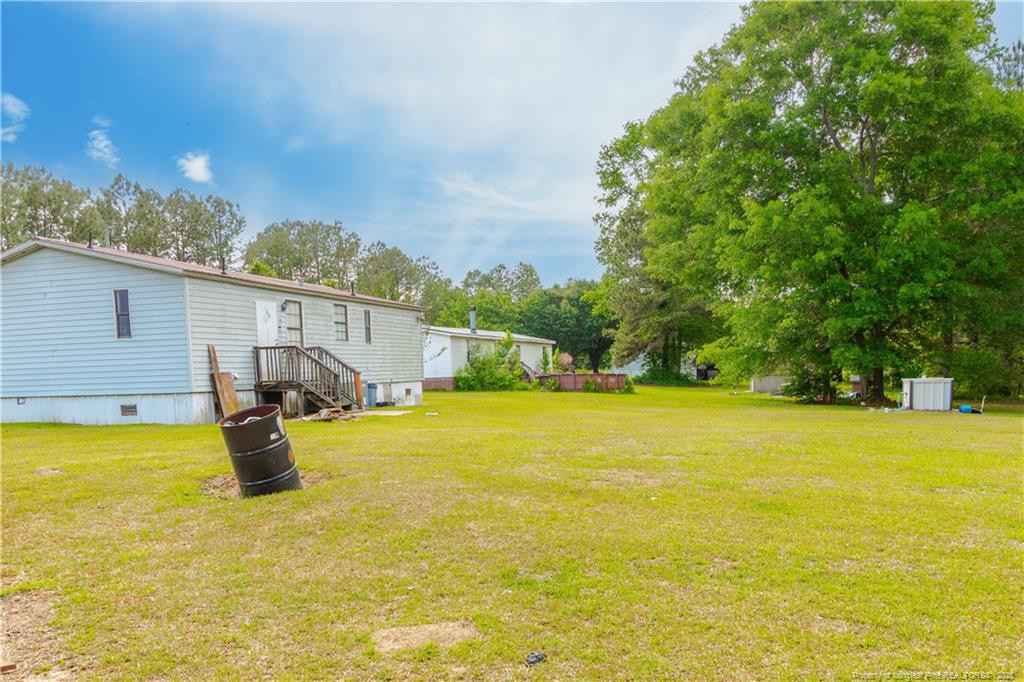 231 Knight Lane Autryville, NC 28318 - Photo 5 of 27 a view of an swimming pool and an outdoor space