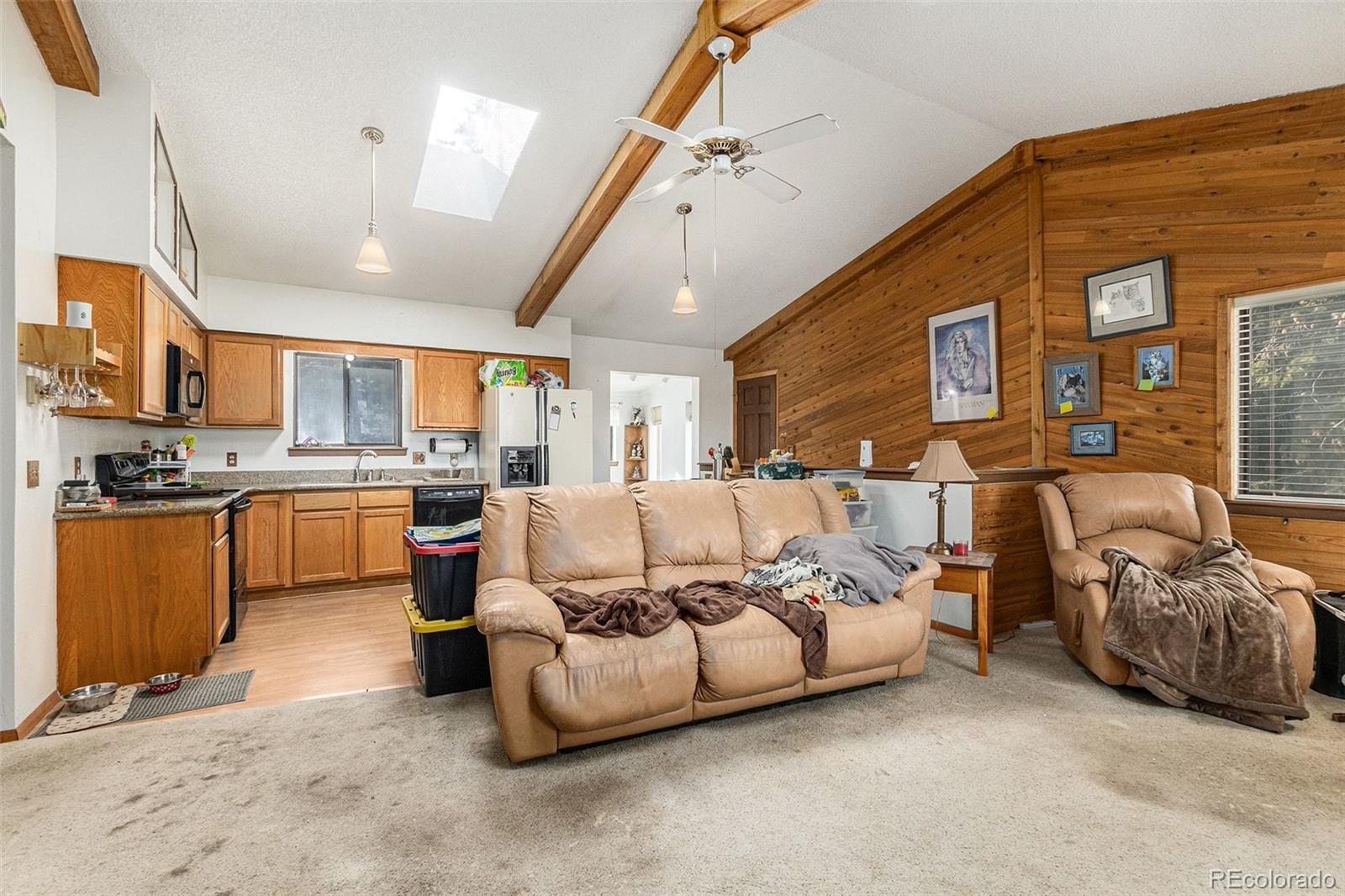 22296 Cook Lane Morrison, CO 80465 - Photo 4 of 19 a living room with furniture and a large window