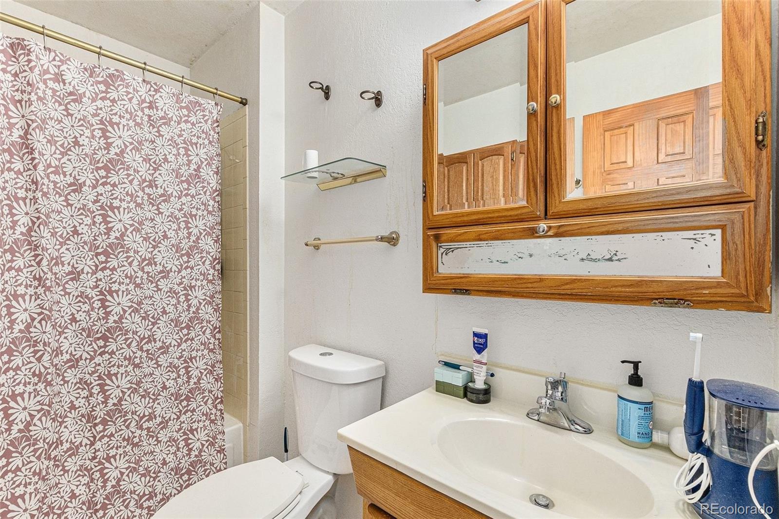 22296 Cook Lane Morrison, CO 80465 - Photo 9 of 19 a bathroom with a sink and a toilet