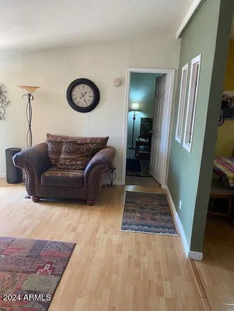 a living room with furniture and a rug
