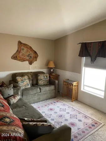 a bedroom with furniture and a window