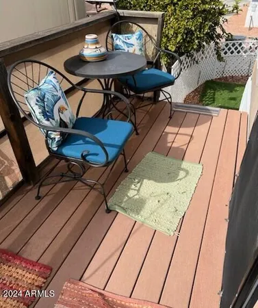 a view of an outdoor sitting area with furniture