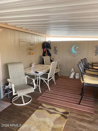 a dining room with furniture and a window