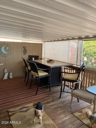 a view of a dining room with furniture and window