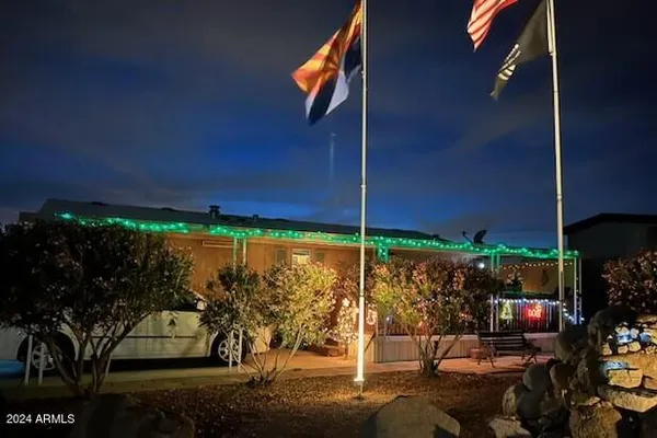 a view of a patio with table and chairs potted plants
