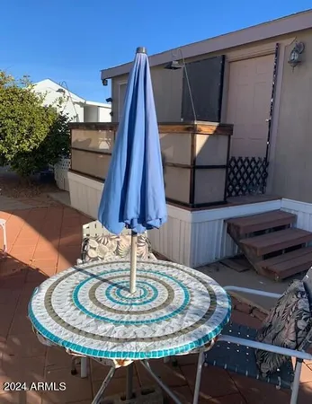 a bed sitting in a room next to a window