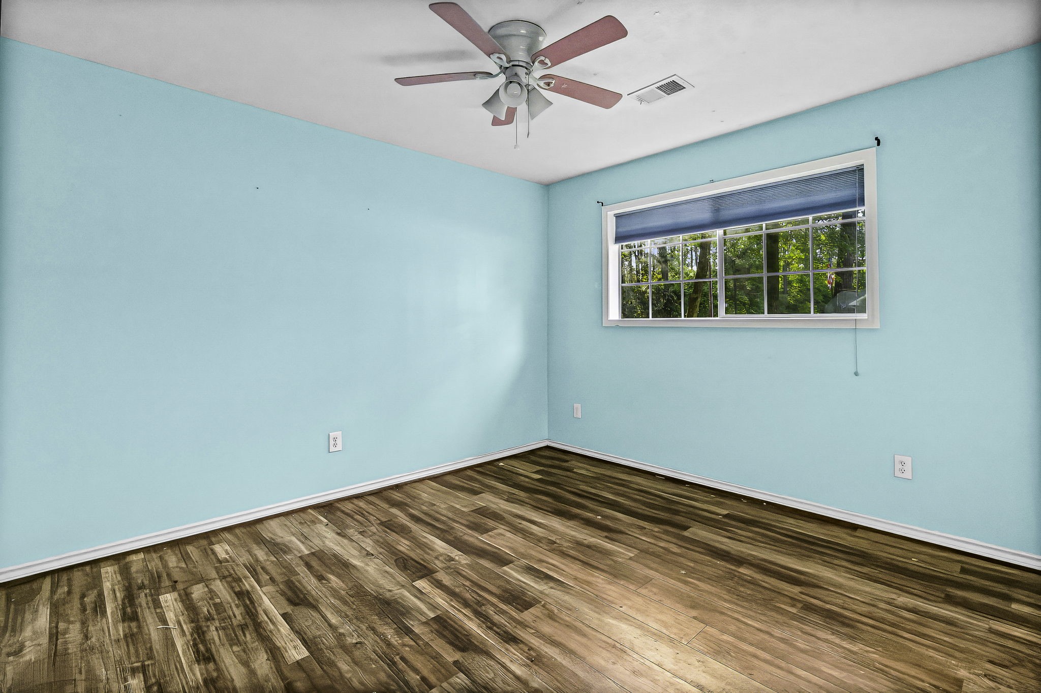 6 Lost Forest Trinity, TX 75862 - Photo 19 of 29 a view of a room with a ceiling fan and a window