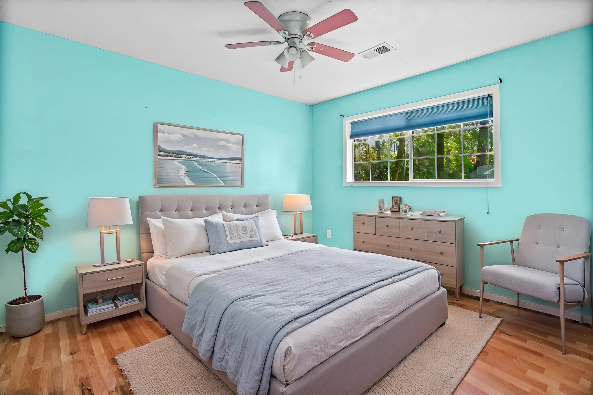 6 Lost Forest Trinity, TX 75862 - Photo 20 of 29 a bedroom with a bed a couch and a potted plant