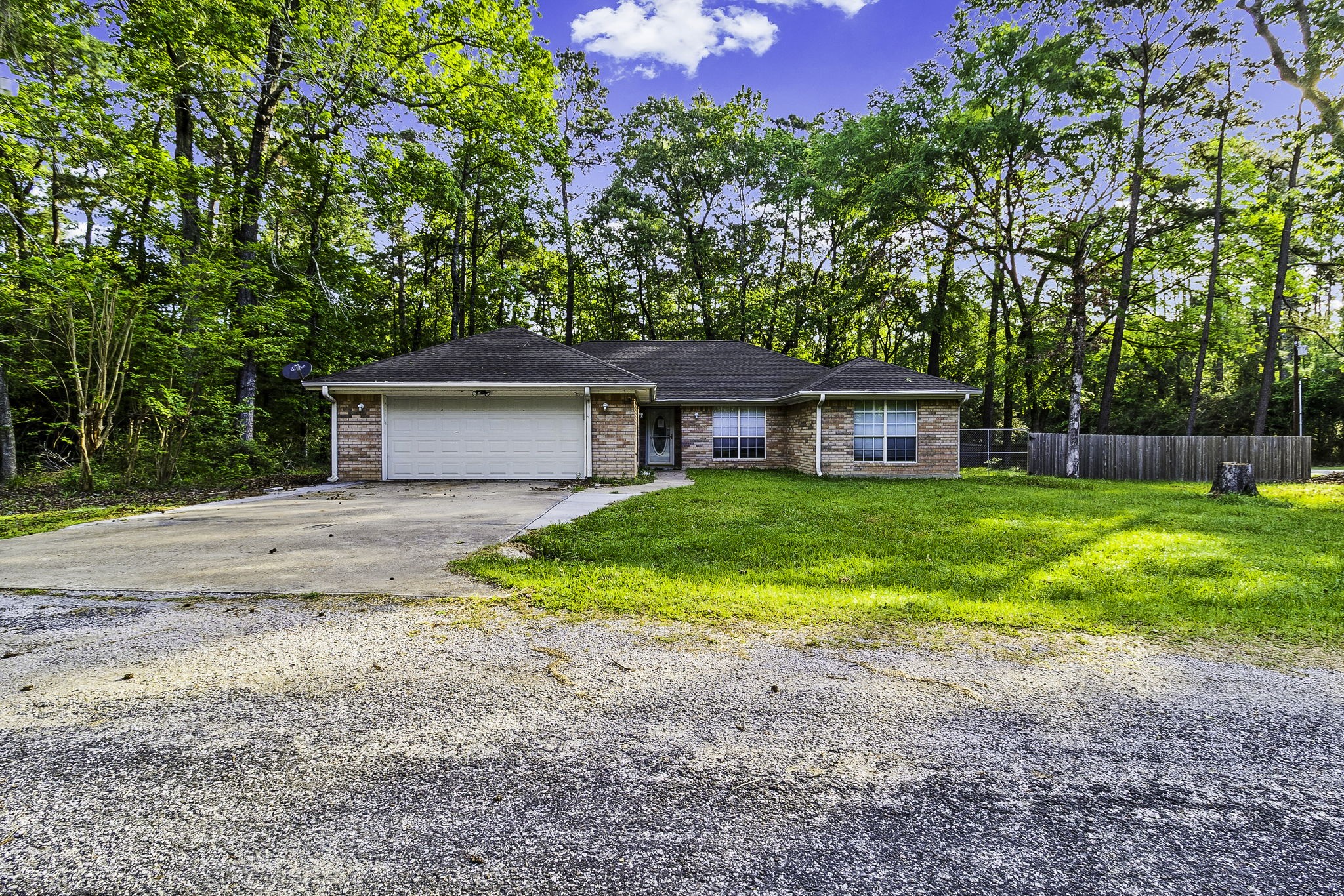 6 Lost Forest Trinity, TX 75862 - Photo 2 of 29 a front view of a house with garden