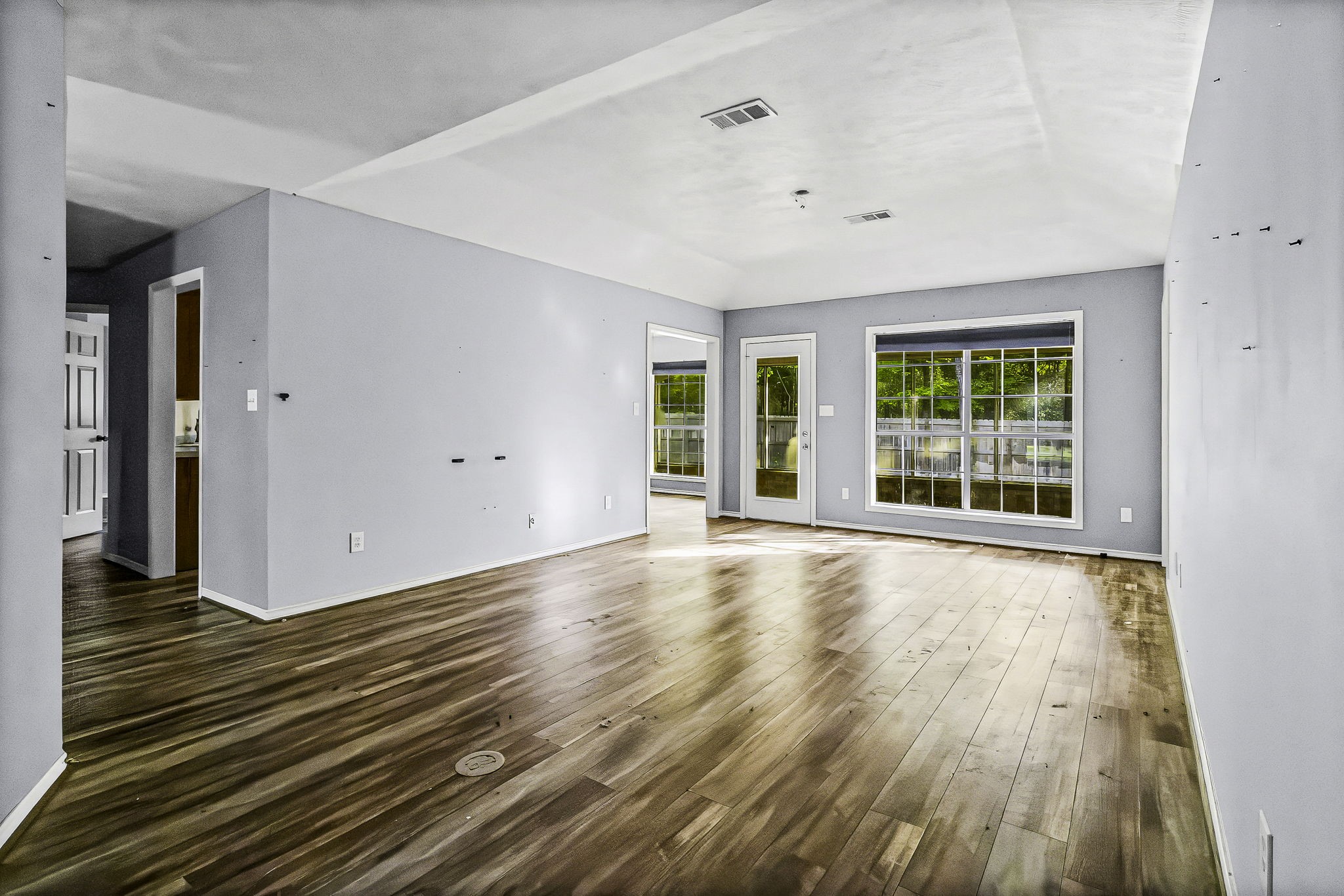 6 Lost Forest Trinity, TX 75862 - Photo 5 of 29 a view of an empty room with wooden floor and a window