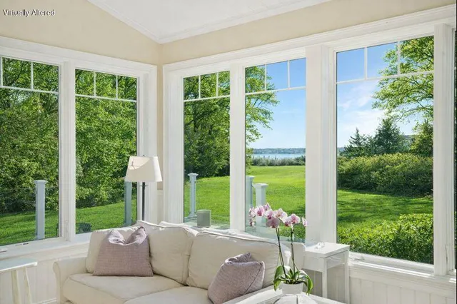 a living room with couch and a garden