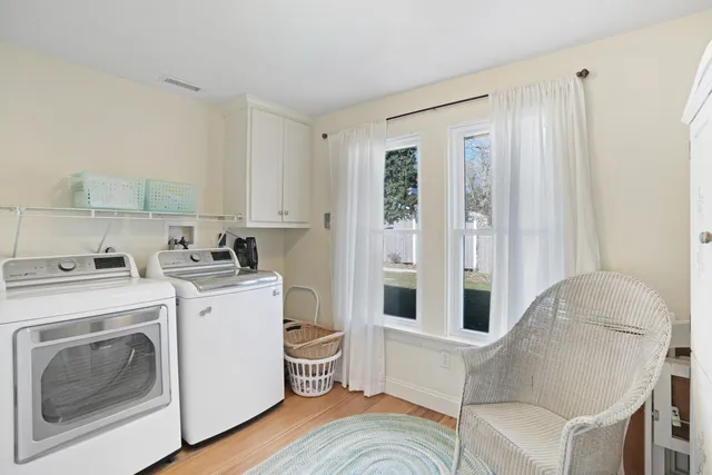 a living room with furniture and a stove