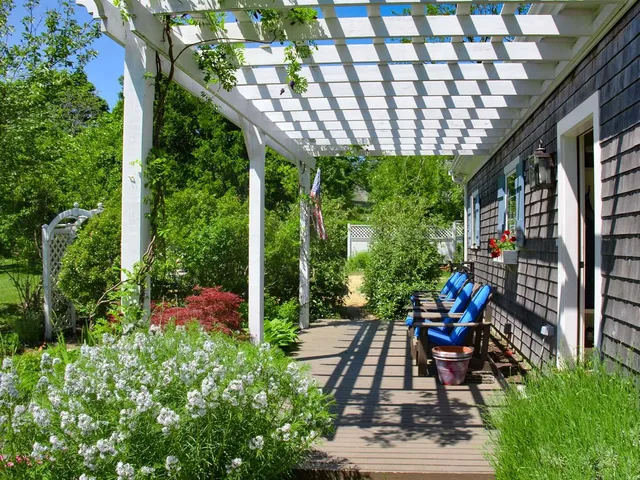 a bench is sitting in middle of garden