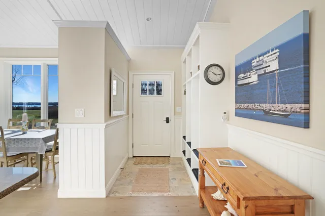 a bedroom with a bed and a table in it