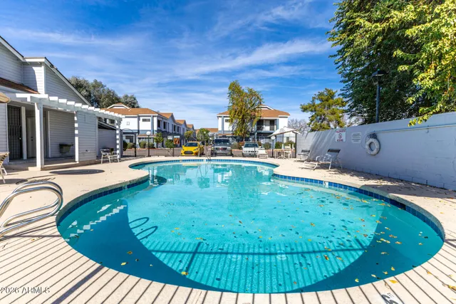 a view of a swimming pool with a patio