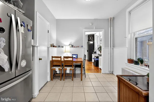 a kitchen with a stove a sink and a stove