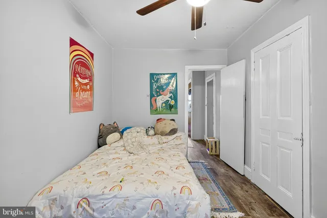 a view of a bedroom with a bed and a chandelier