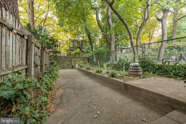 a front view of a house with trees