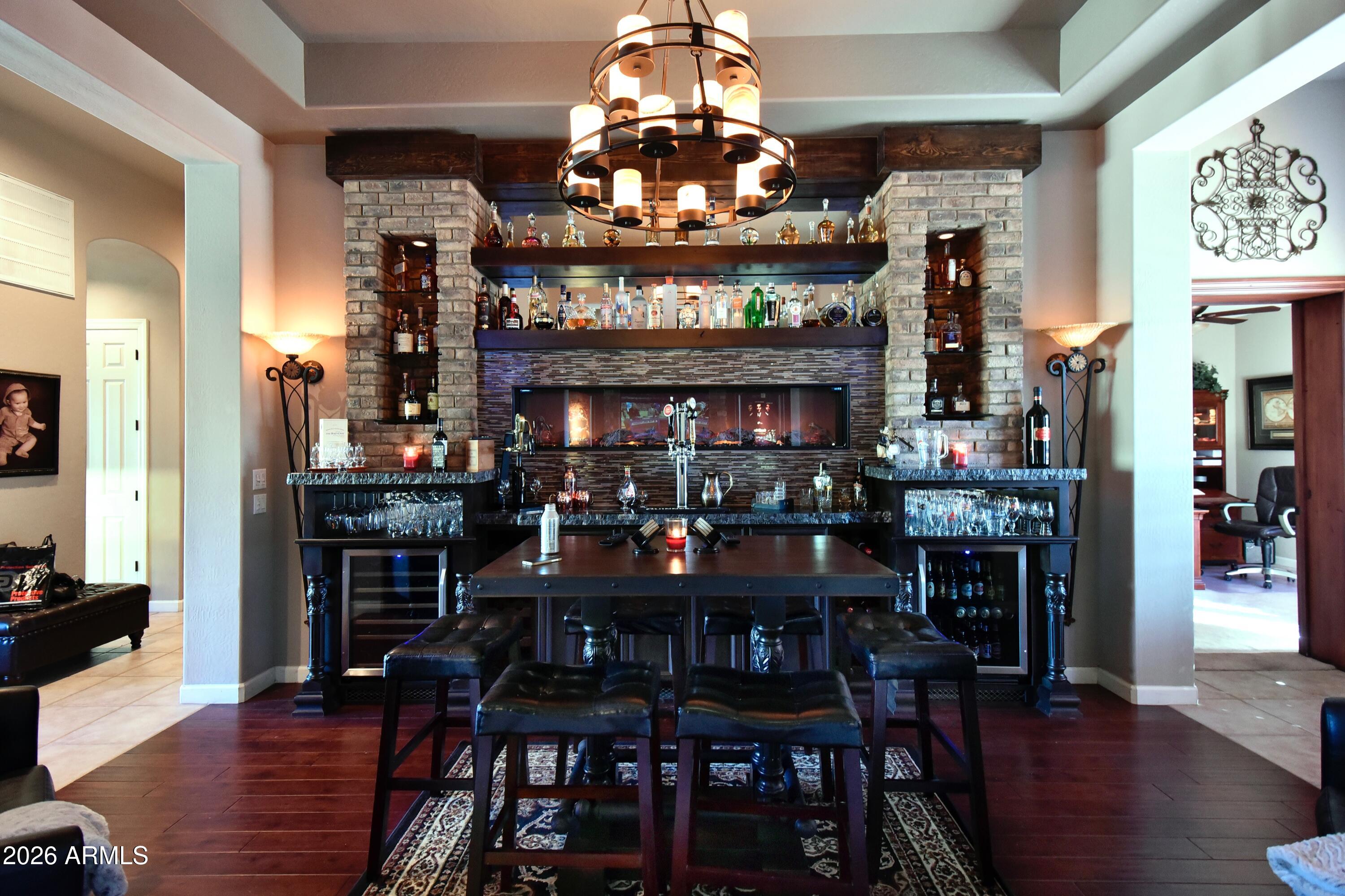 4046 North Silver Ridge Circle Mesa, AZ 85207 - Photo 18 of 61 a view of a dining room with furniture and wooden floor