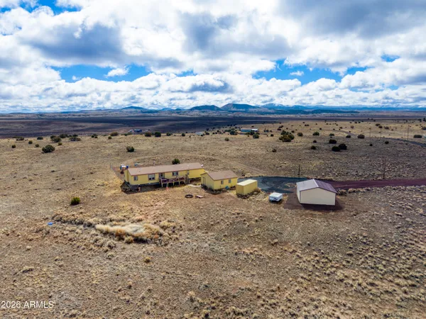 a view of a backyard of the house