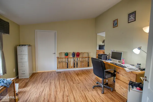 a workspace with furniture hardwood and a window