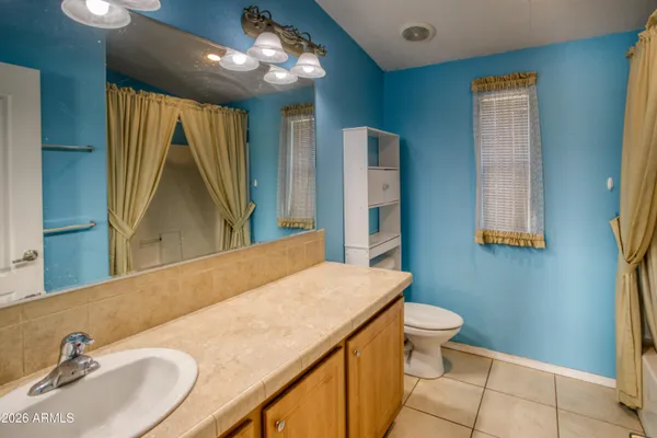 a view of a bathroom with white walls