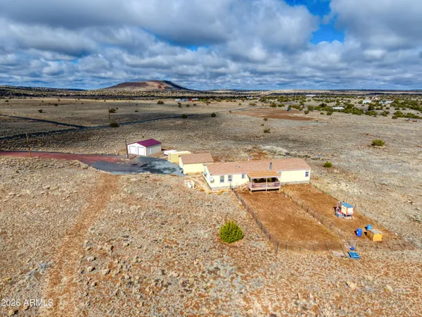 a picture of a wall with a white building