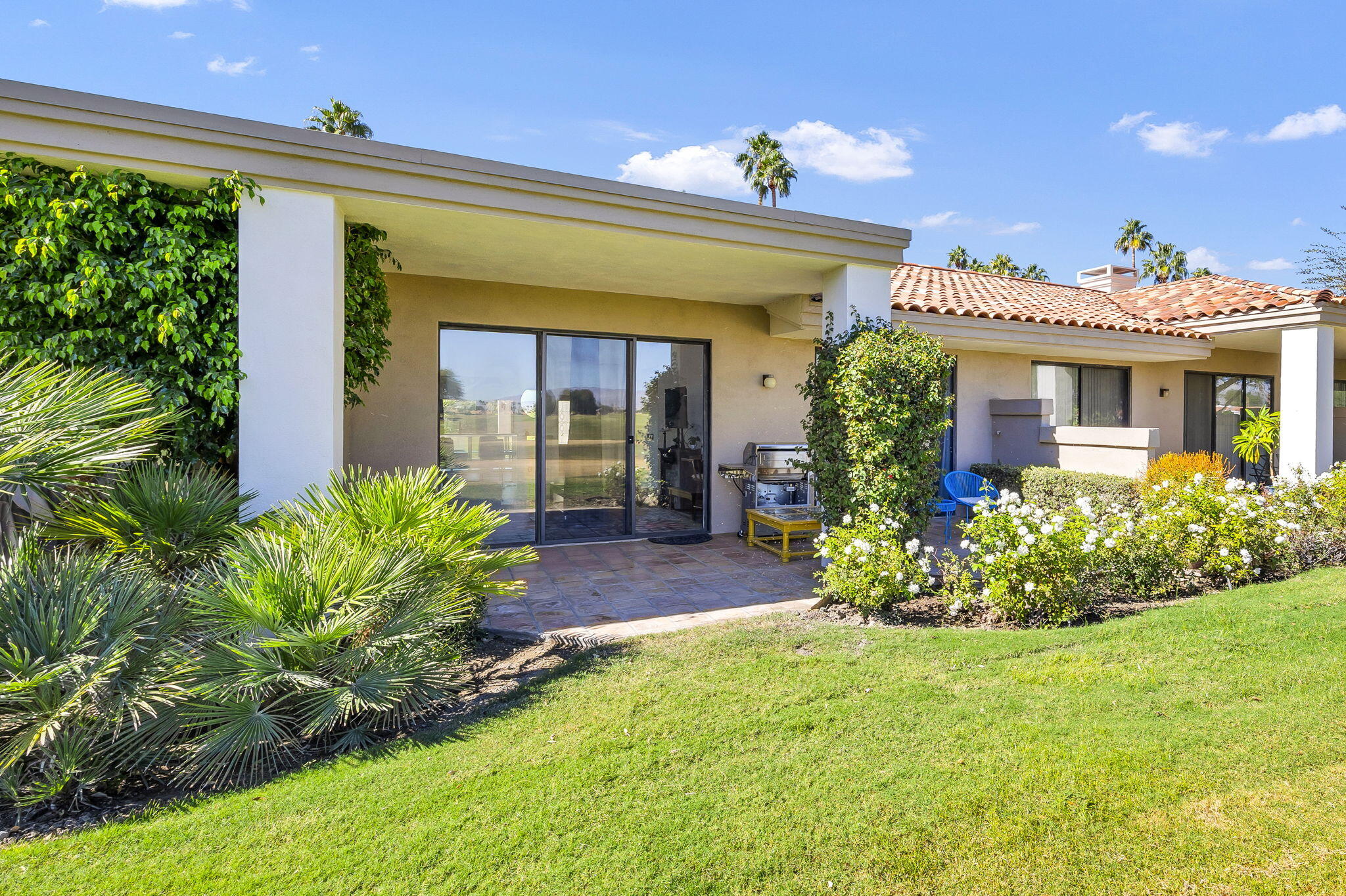 54880 Inverness Way La Quinta, CA 92253 - Photo 17 of 20 a front view of a house with a porch