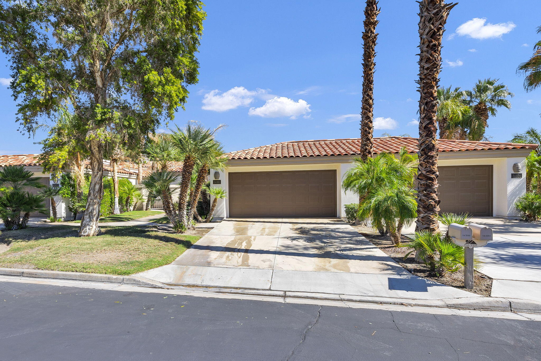 54880 Inverness Way La Quinta, CA 92253 - Photo 20 of 20 a view of front door of house with yard