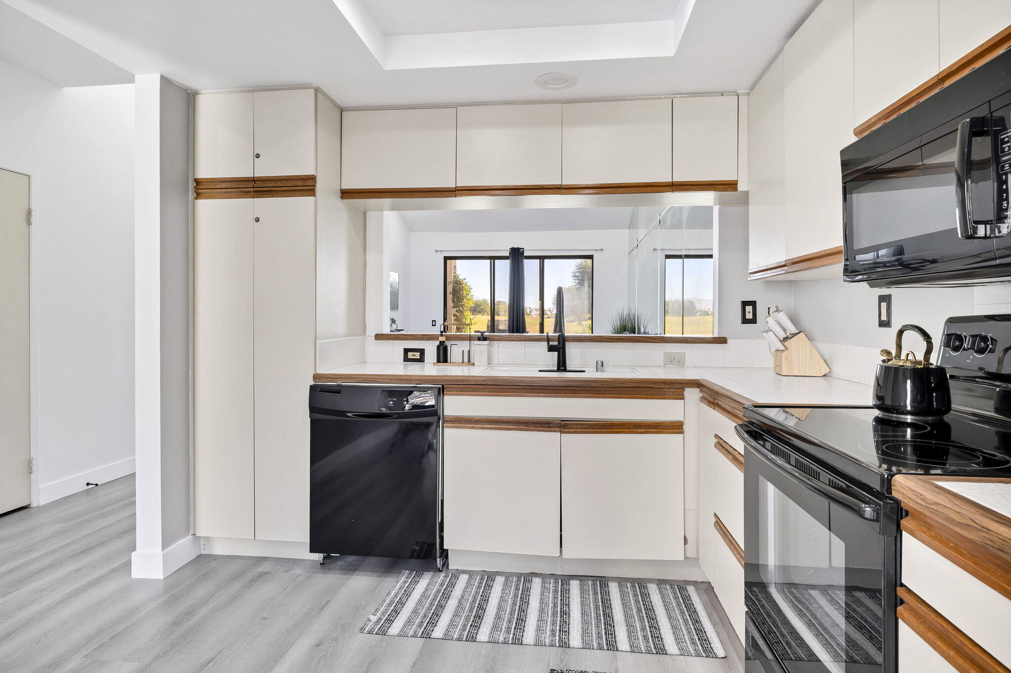 54880 Inverness Way La Quinta, CA 92253 - Photo 7 of 20 a kitchen with a refrigerator and a sink