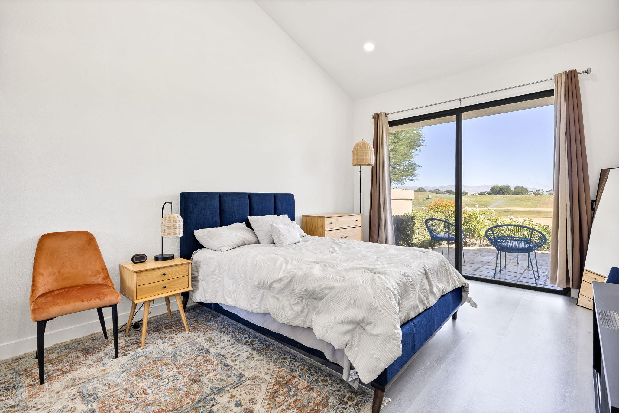 54880 Inverness Way La Quinta, CA 92253 - Photo 9 of 20 a bedroom with a bed and glass window