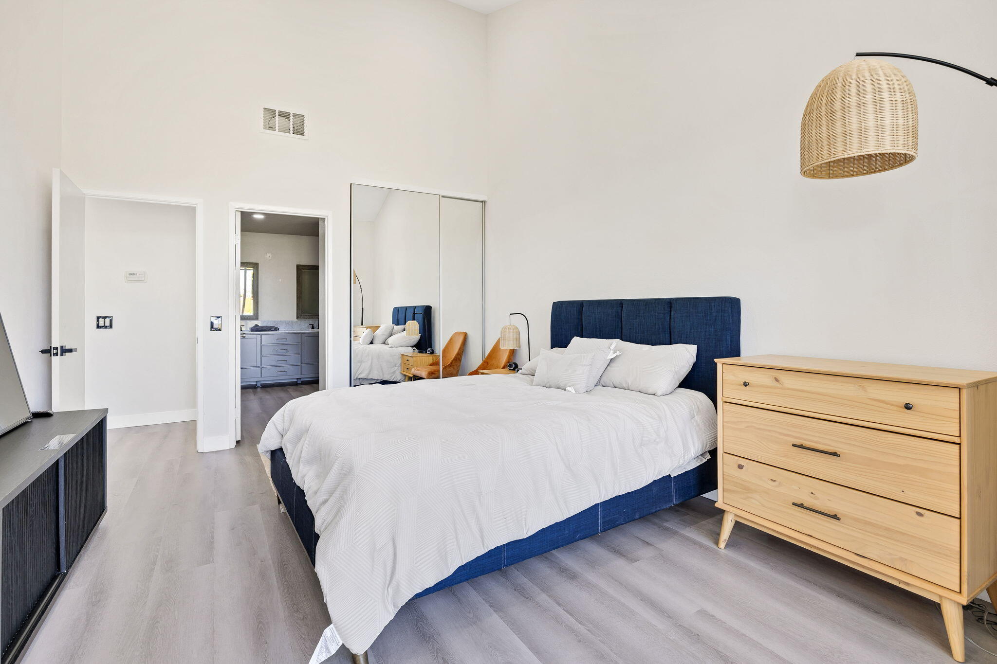 54880 Inverness Way La Quinta, CA 92253 - Photo 10 of 20 a bedroom with a bed and a mirror