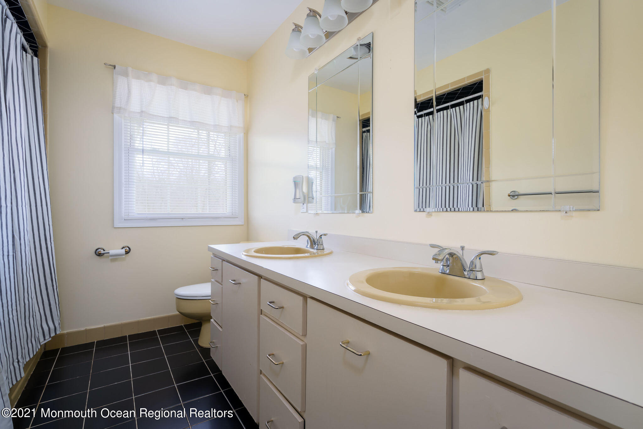 1759 Todd Road Toms River, NJ 08755 - Photo 33 of 58 a bathroom with a sink toilet and window