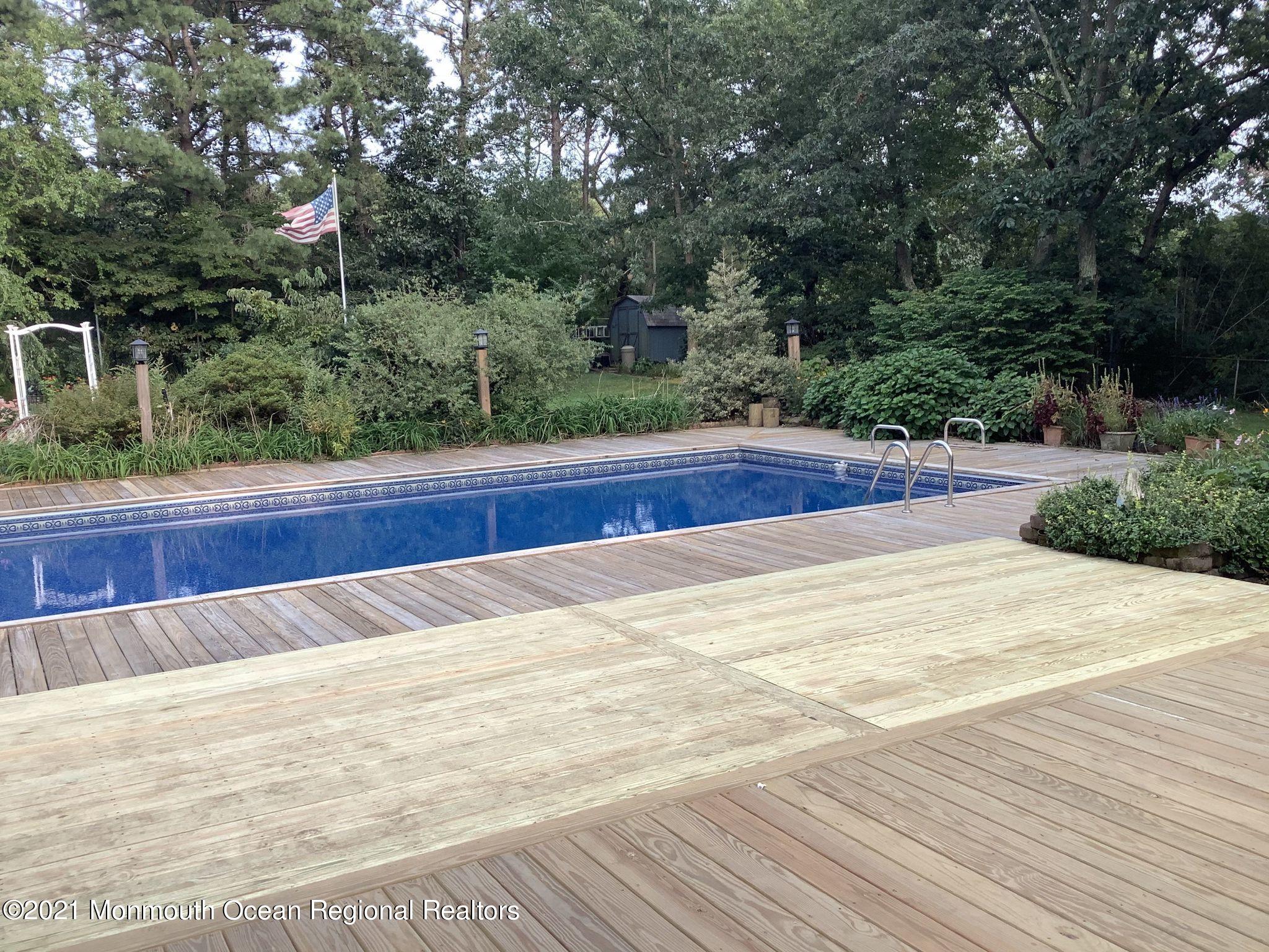1759 Todd Road Toms River, NJ 08755 - Photo 44 of 58 a view of swimming pool and trees in the background