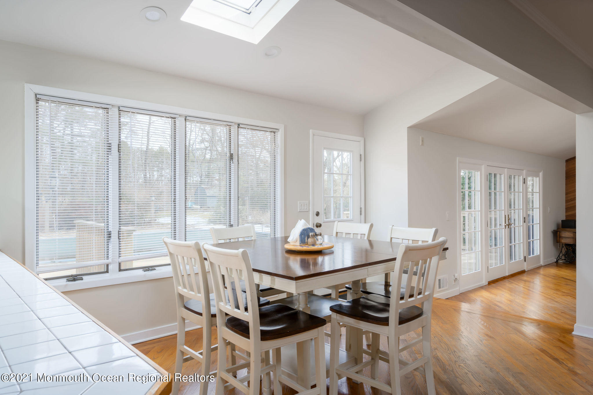 1759 Todd Road Toms River, NJ 08755 - Photo 9 of 58 a dining room with furniture wooden floor and a chandelier
