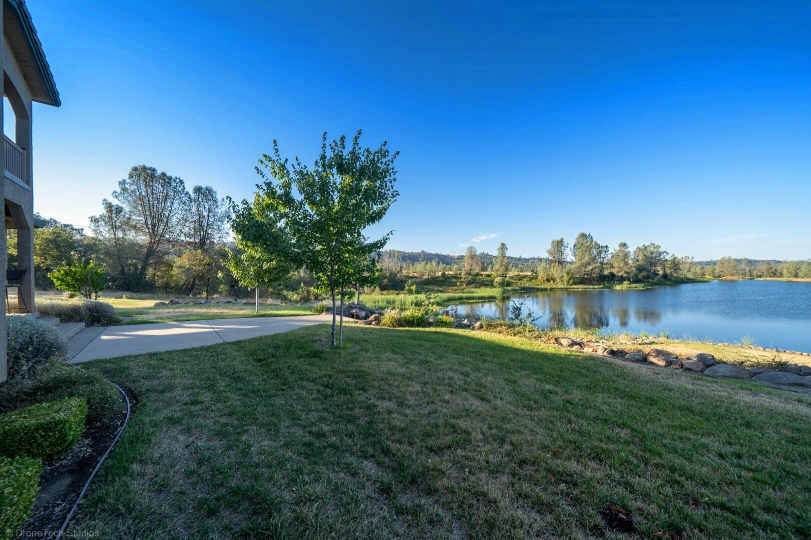 12339 Fern Road Whitmore, CA 96096 - Photo 122 of 152 a view of a lake with houses in the back