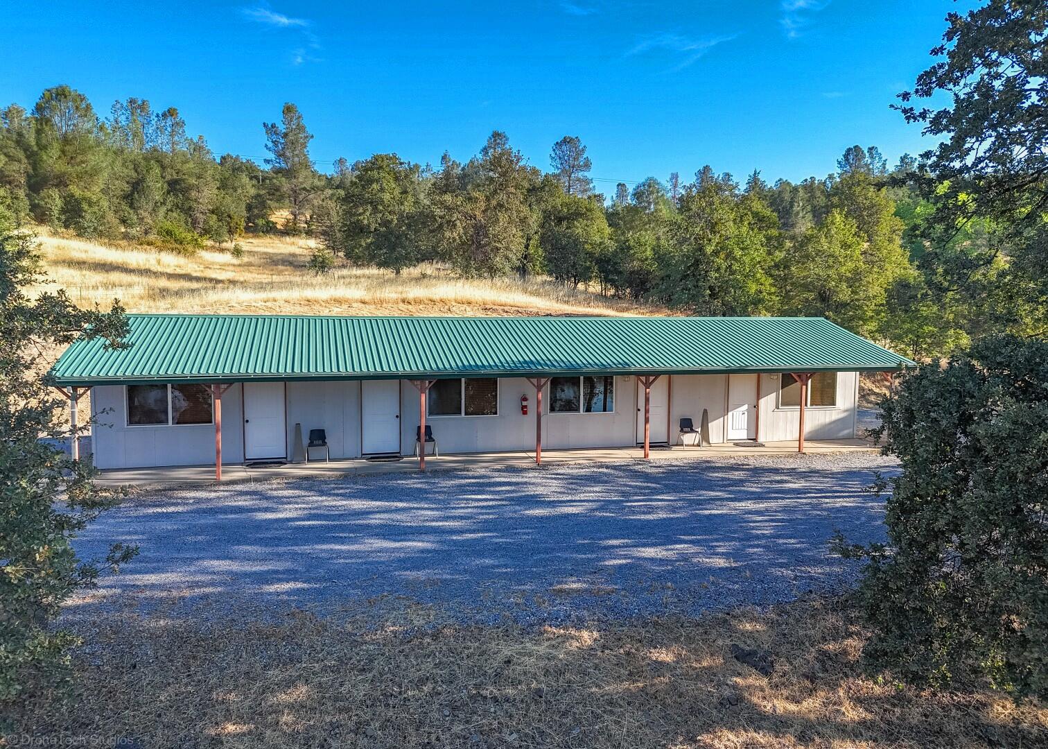 12339 Fern Road Whitmore, CA 96096 - Photo 62 of 152 a front view of a house with a yard