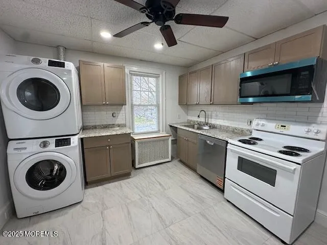 a kitchen with a stove top oven and cabinets